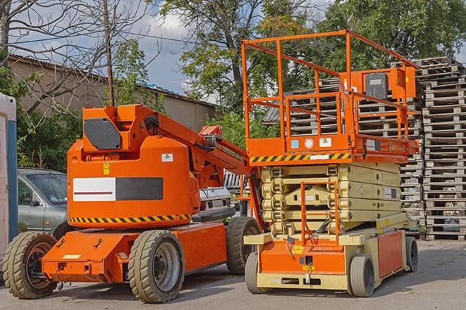 warehouse worker operating forklift for inventory management in Avon